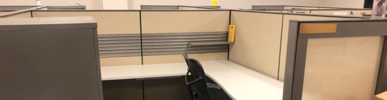 An empty, used Herman miller cubicle.